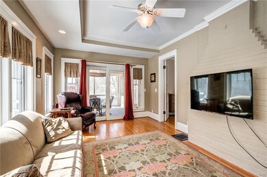 FAMILY ROOM FLOWS BEAUTIFULLY INTO THE SCREENED IN