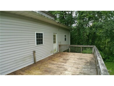 Large 20' x 12' wood deck on rear of house.