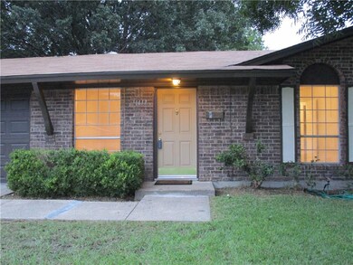 Cute entryway walk up with little covered porch ar