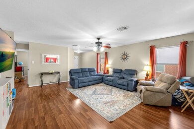 Living room with view of entryway.