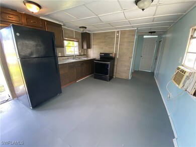 Kitchen featuring black appliances and sink