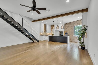 Open floor Plan, Featuring Hand forged Steel and White oak Stairs, Chicago Brick, walk in pantry, gas cooktop and more!