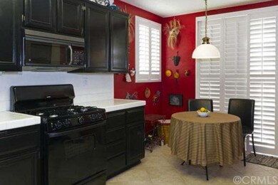 Large kitchen with breakfast table and more planta