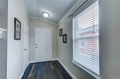 Light and bright entry way with coat closet for al