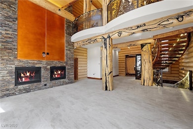 Great room with rustic walls, a fireplace and Japa