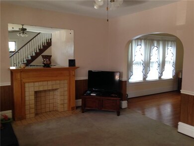 Living Room, Dining Room. Note stairway in mirror