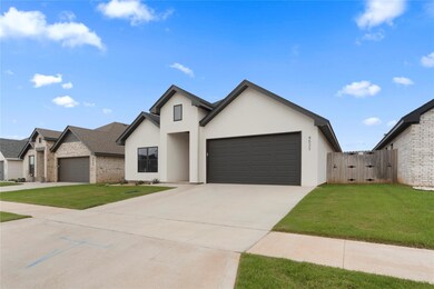 View of front of house featuring a garage and a fr