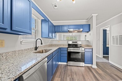 Kitchen with ornamental molding, stainless steel a