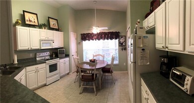 Kitchen Updated Cabinetry,and Laundry Area Enclosed in Utility Closet