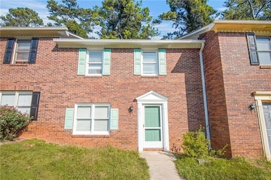 View of front of house featuring brick siding