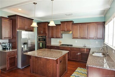 HARDWOODS / GRANITE KITCHEN & ISLAND / TILE BACKSP