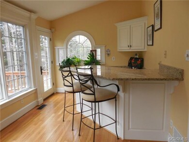 Vaulted Florida Room with granite topped bar and w