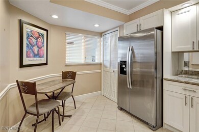 Kitchen with stainless steel refrigerator with ice