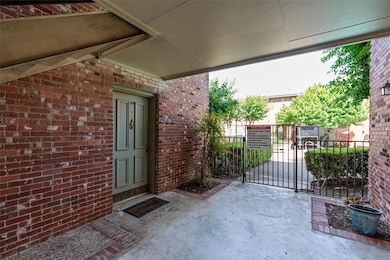 Property entrance featuring brick siding