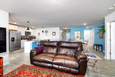 Living room featuring sink and light hardwood / wo