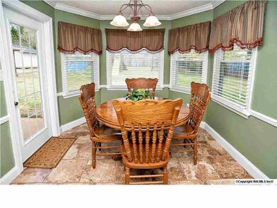 Bright breakfast area with great bay windows and access to the back patio and yard.