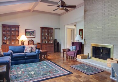 Step down into Great room from Foyer. Vaulted ceiling and floor to ceiling brick fireplace.