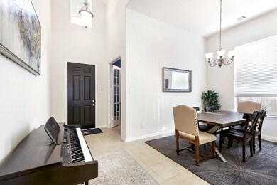 Faceing the front door to the Right is your Private Home Office and Formal Dining room.