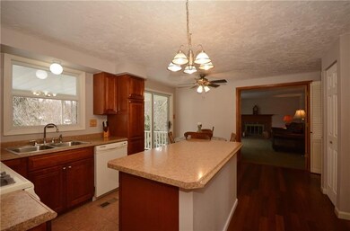 Another view of the kitchen which opens to the fam