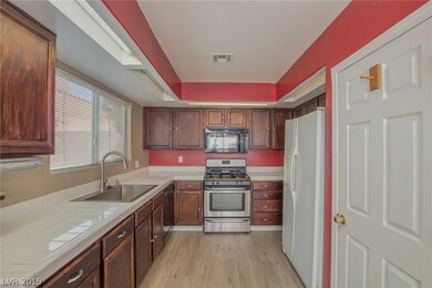 Kitchen with new sink and microwave..