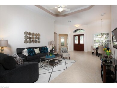 View of front entry, past family / great room. Off