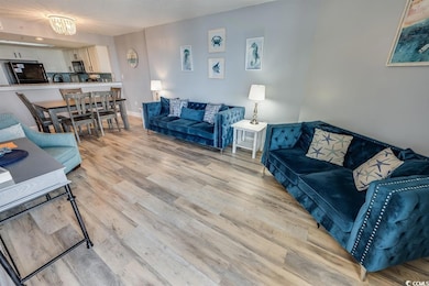 Living room with light wood-type flooring and base