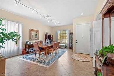 Tiled dining room with track lighting, recessed li