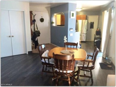 Dining area, front door and kitchen view