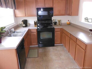 This picture is digitally staged - there is no furniture in the home and none of the furnshings seen here are included in the sale.
