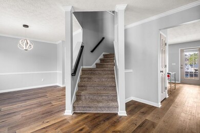 Stairway featuring wood finished floors, a texture