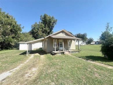 View of front of house with covered porch and a fr