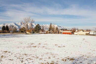Snowy yard featuring a mountain view
