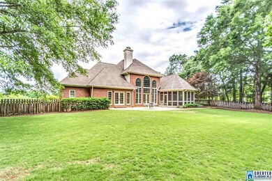 Fully fenced yard with gorgeous shade trees.
