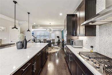 Kitchen featuring stainless steel gas cooktop, an 
