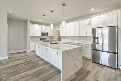 Kitchen with white cabinetry, stainless steel appl
