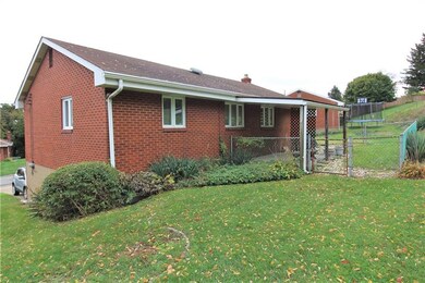 Rear yard with small fenced in area for your small