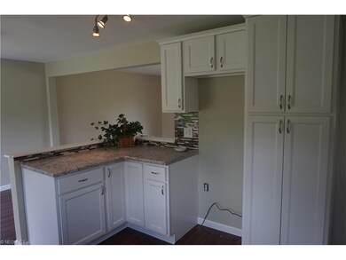 Large kitchen offers pantry and bar area open to d