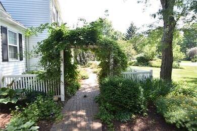 Charming custom front brick walkway with Millstone