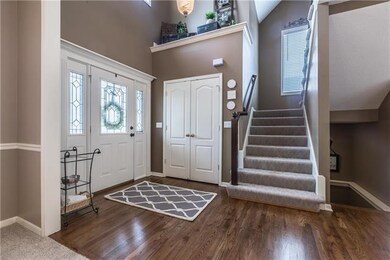 Entry with newly refinished hardwoods and high tra
