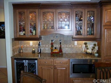CUSTOM KITCHEN CABINETS THROUGHOUT W/PULL-OUT POT 