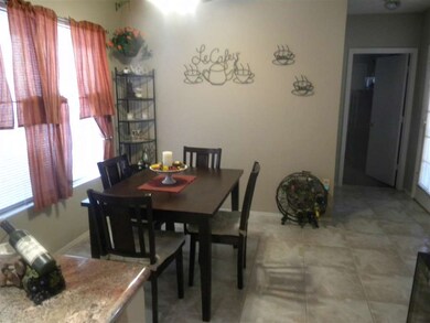 eat in kitchen / neutral tile floors