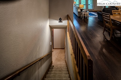   Stairway to lower level from foyer or right to k