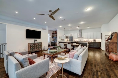 the seamless flow between the living, dining, and kitchen areas, perfect for entertaining or relaxing in style