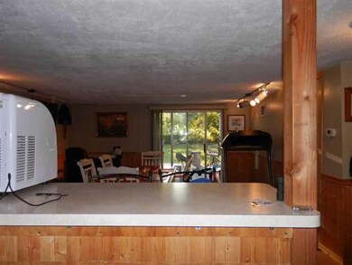 Kitchen breakfast bar between kitchen and dining-f