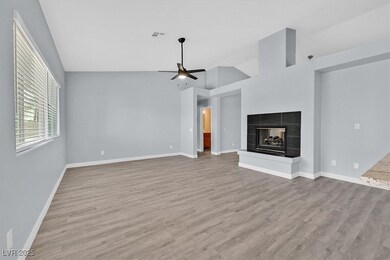 Unfurnished living room featuring vaulted ceiling,
