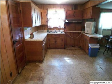 Eat in Kitchen with pantry, ceiling fan and crown mold