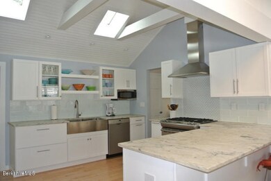 Stylish kitchen overlooks the pond, too