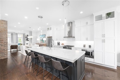 Spacious Chef's Kitchen with huge island and plenty of cabinets.