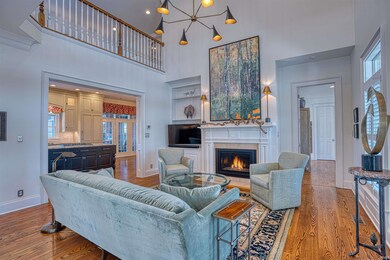 Complete with soaring ceiling and a gas fireplace.