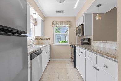 Kitchen featuring stainless steel appliances, a s